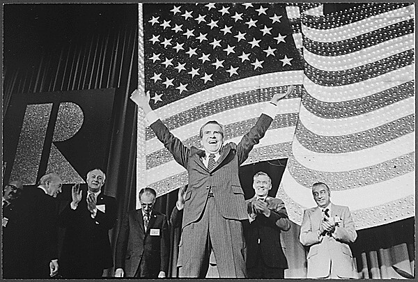 President Richard Nixon gestures to supporters at a rally